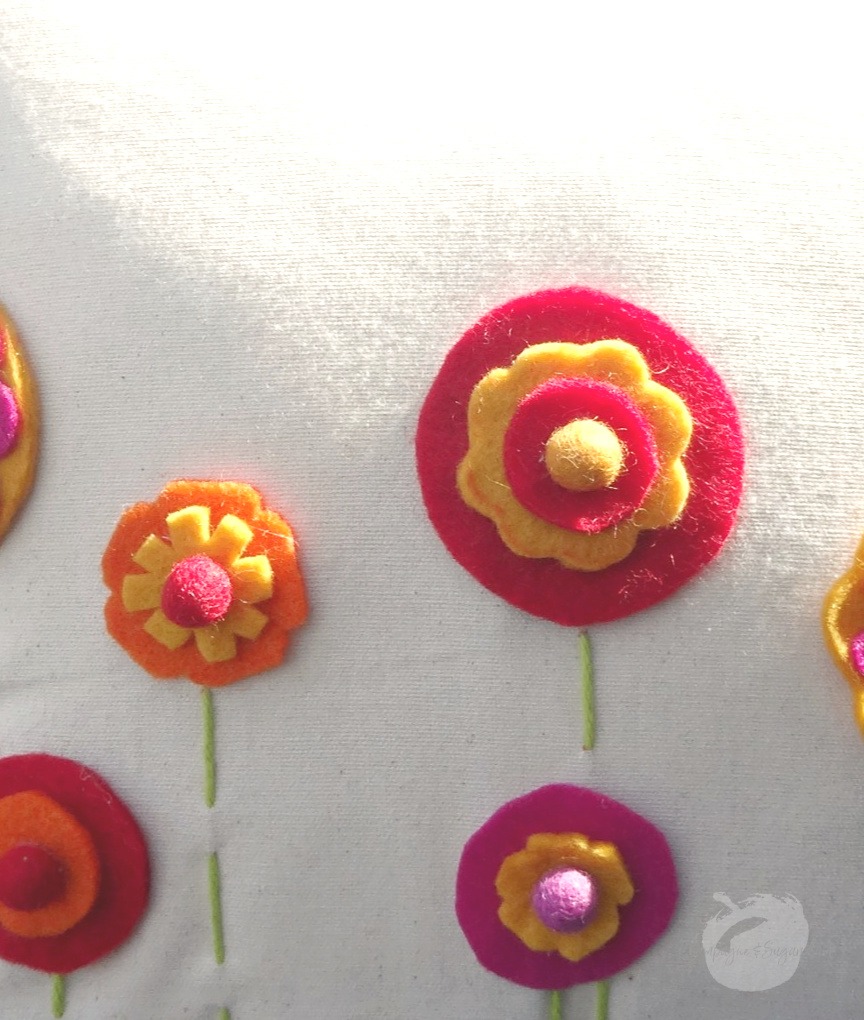A close up of the finished felt flowers by Champagne and Sugarplums
