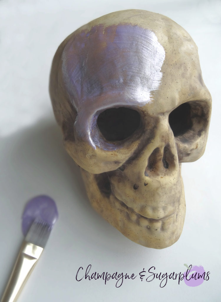 Painting a paper skull lilac by Champagne and Sugarplums 