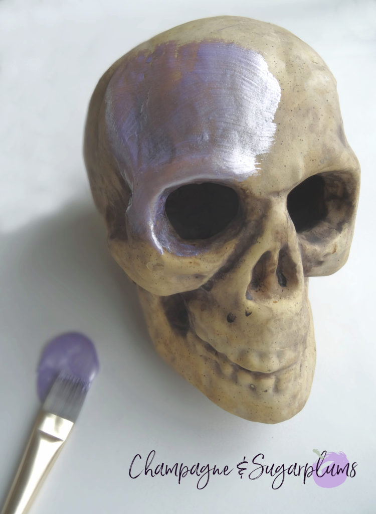 Painting a paper skull lilac by Champagne and Sugarplums