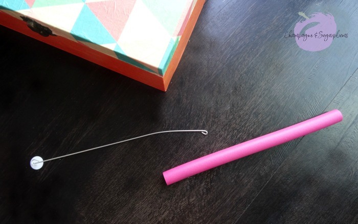 Removing a wire insert from a pink foam hair roller by Champagne and Sugarplums