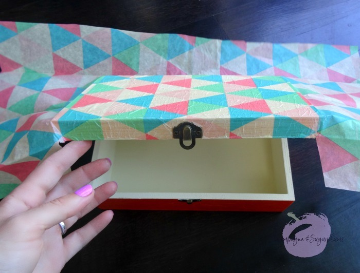 Application of tissue paper to the box lid by Champagne and Sugarplums