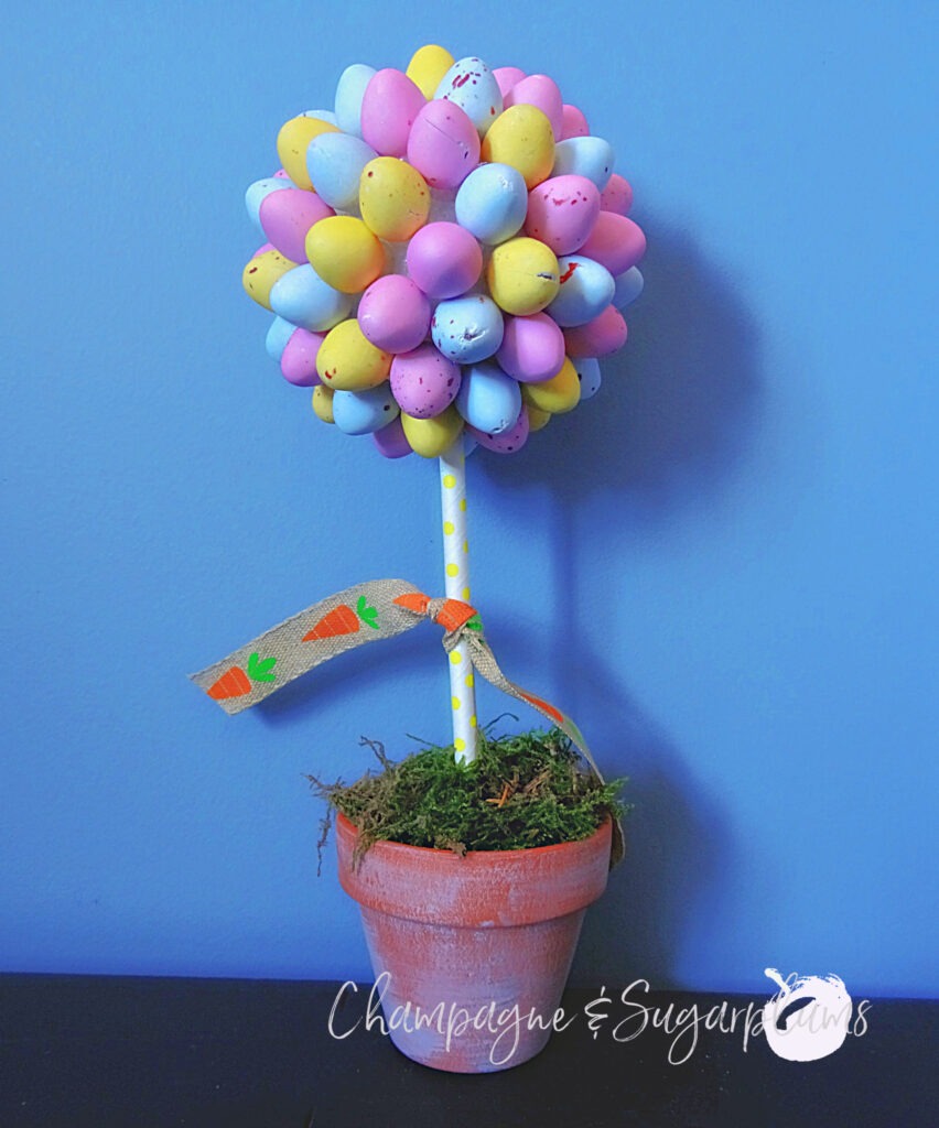 Completed mini egg topiary on a blue background by Champagne and Sugarplums
