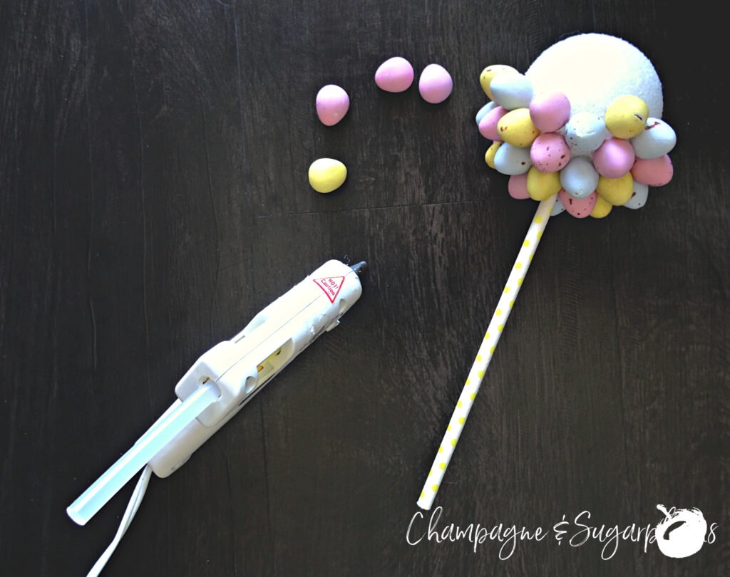How to attach mini eggs to a Styrofoam ball by Champagne and Sugarplums