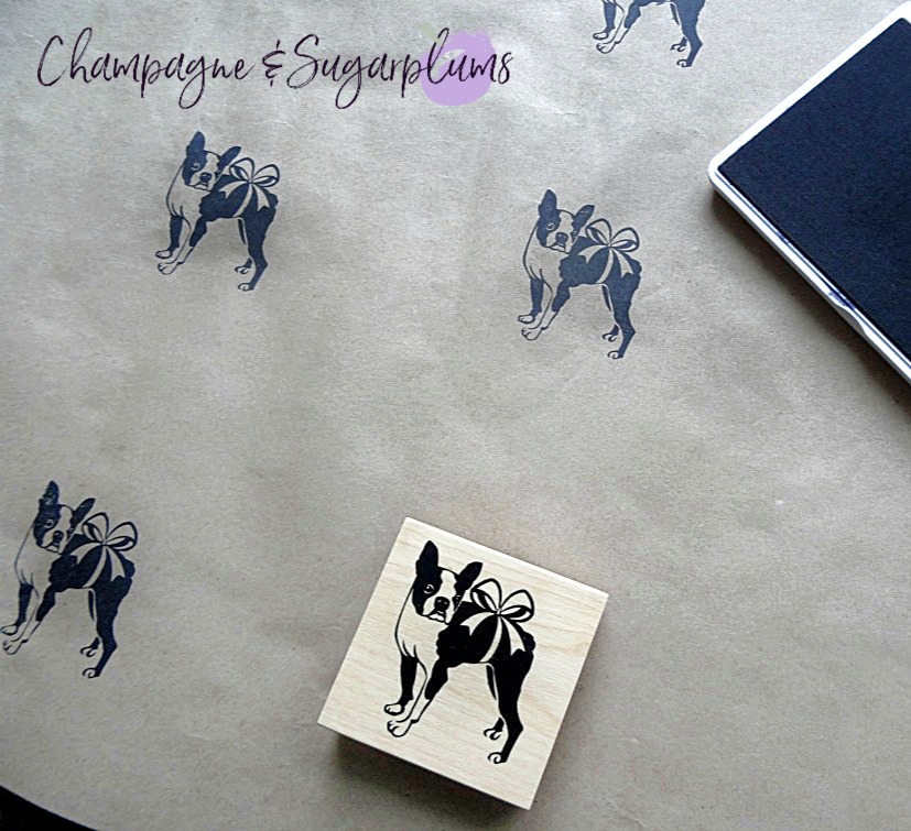 Butcher paper stamped with Boston terriers wrapped in a bow with an ink pad by Champagne and Sugarplums