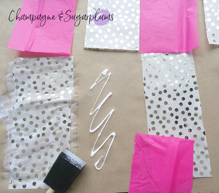 Pink and gold polka dot tissue paper glued in random patterns onto butcher paper by Champagne and Sugarplums