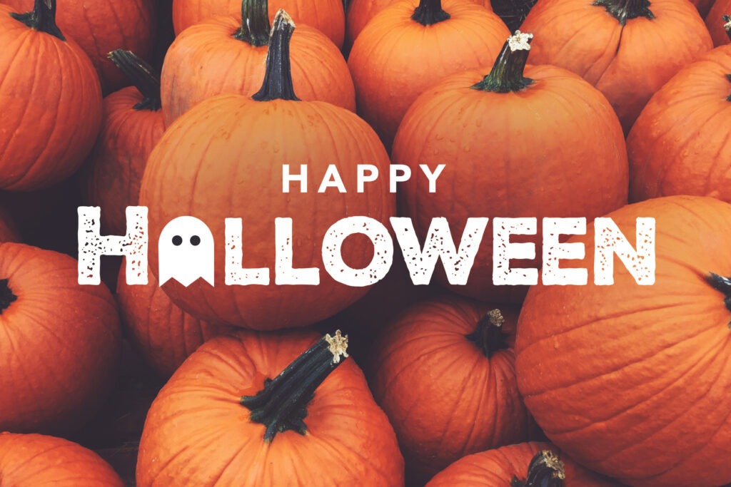 Happy Halloween written on a background of pumpkins