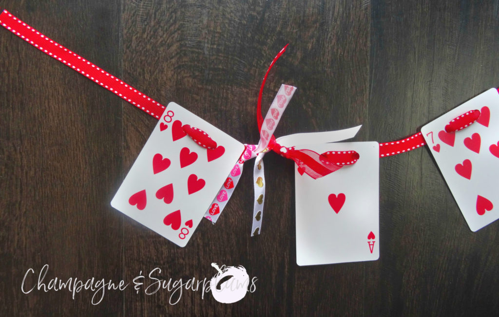 Heart cards garland having ribbons tied on for embellishment by Champagne and Sugarplums