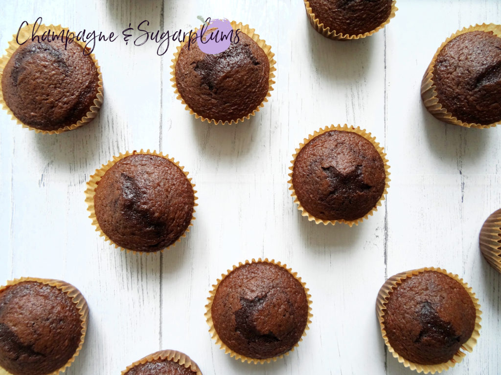 Chocolate cupcakes on a white background by Champagne and Sugarplums