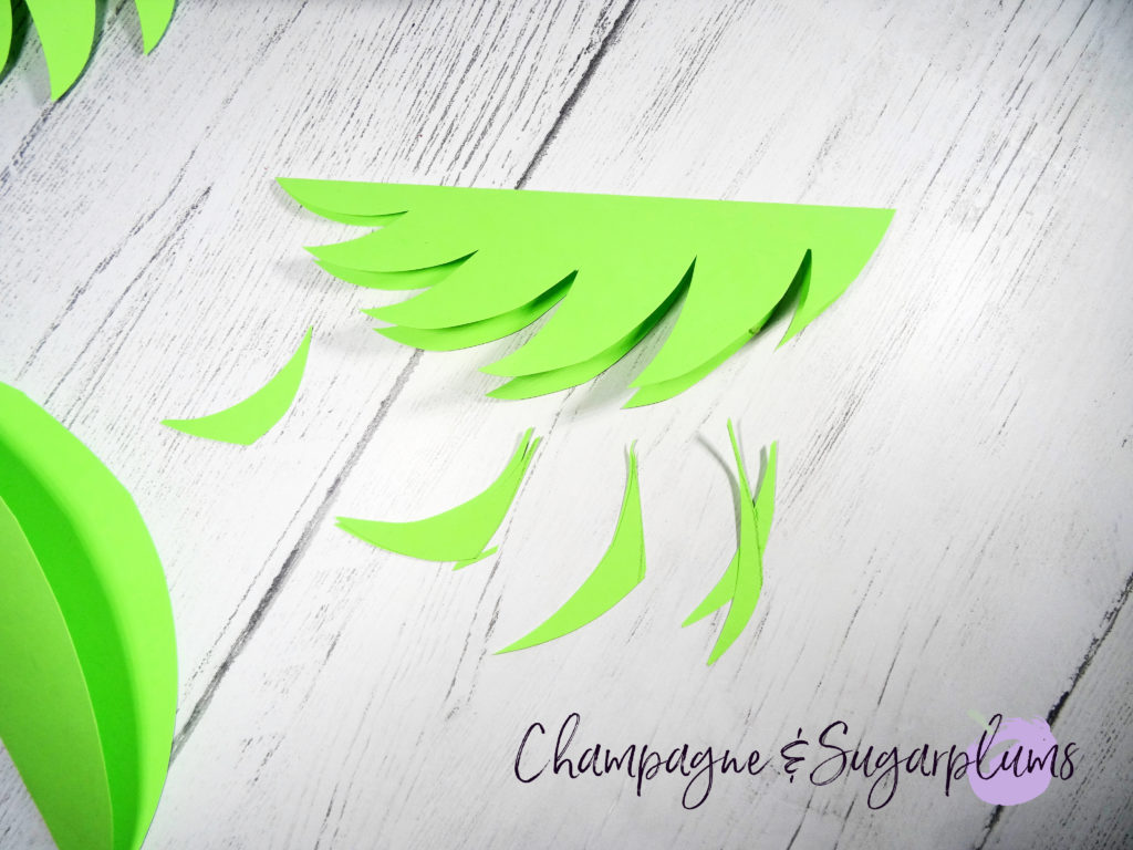 Cutting leaves from green paper by Champagne and Sugarplums