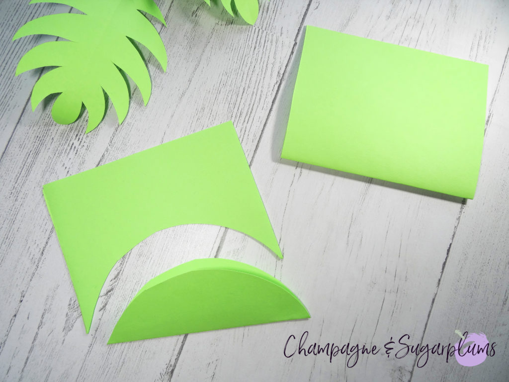 Cutting leaves from green paper by Champagne and Sugarplums