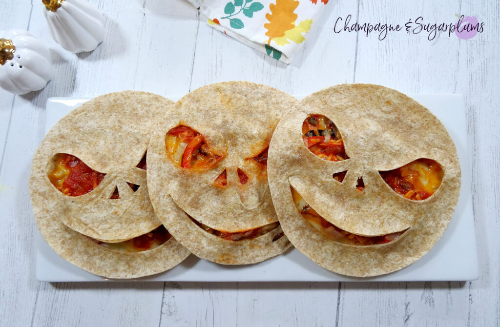 Three Creepy Quesadillas on a white plate by Champagne and Sugarplums