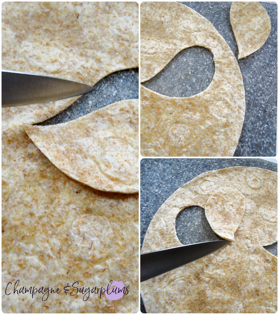 Cutting scary eyes into a tortilla on a grey cutting board by Champagne and Sugarplums