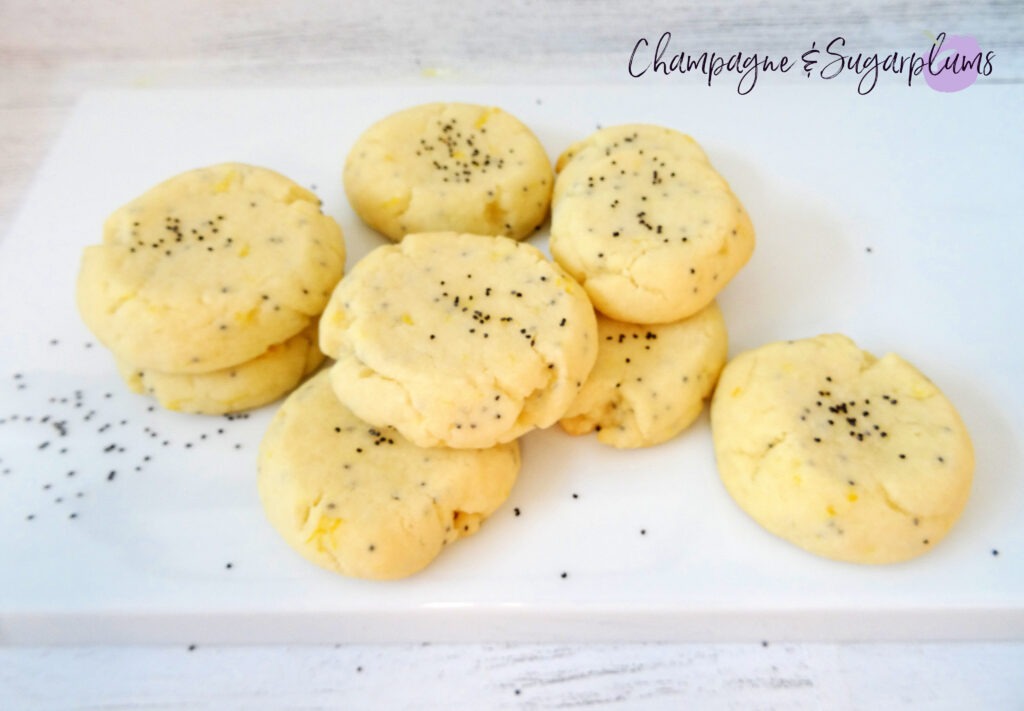 Lemon Poppy Seed Cookies on a white plate by Champagne and Sugarplums
