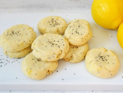 Lemon Poppy Seed Cookies on a white plate by Champagne and Sugarplums