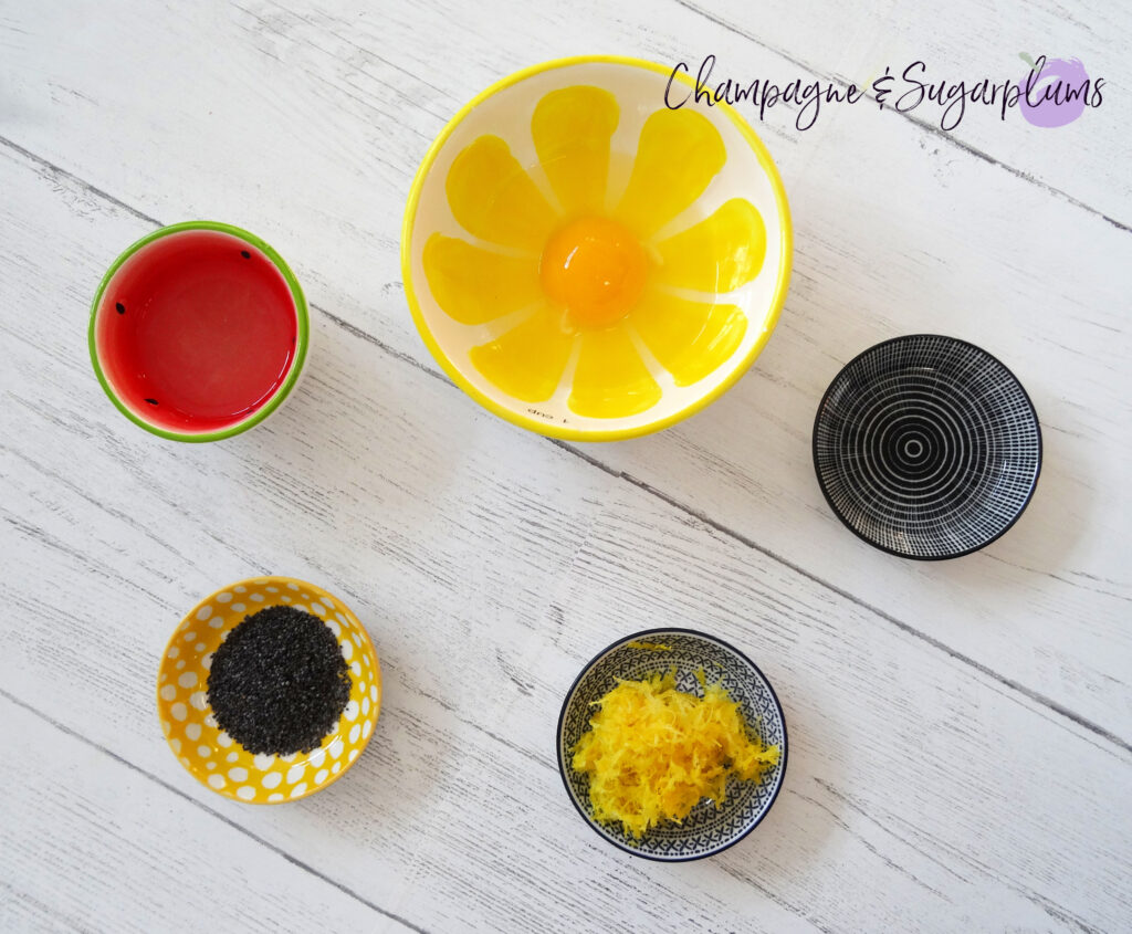 Various baking ingredients in coloured pinch bowls by Champagne and Sugarplums