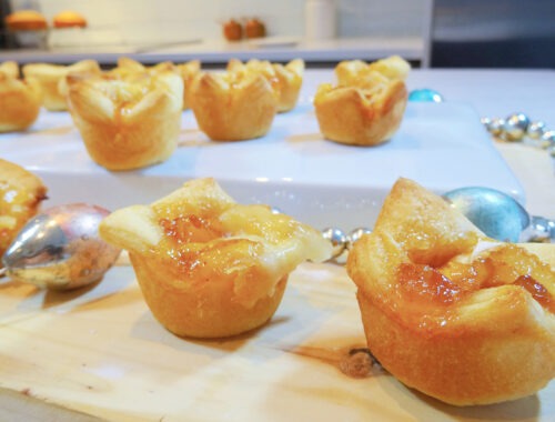 Brie mango bites on a wood tray by Champagne and Sugarplums