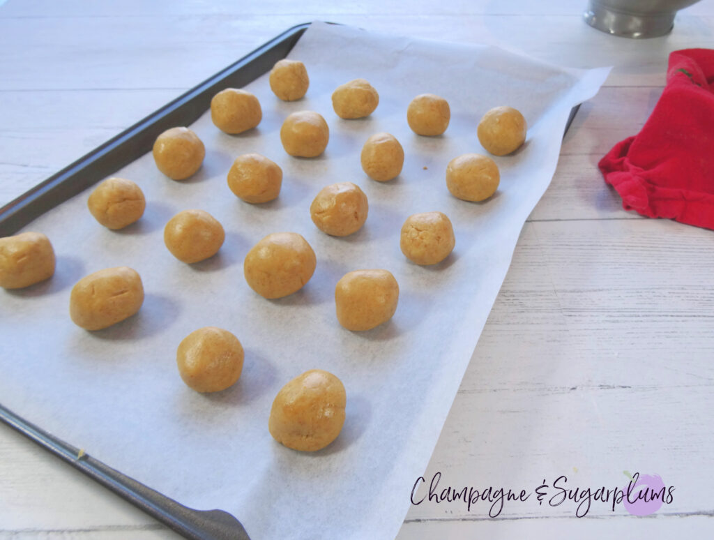 Snowball treats on a baking tray by Champagne and Sugarplums 