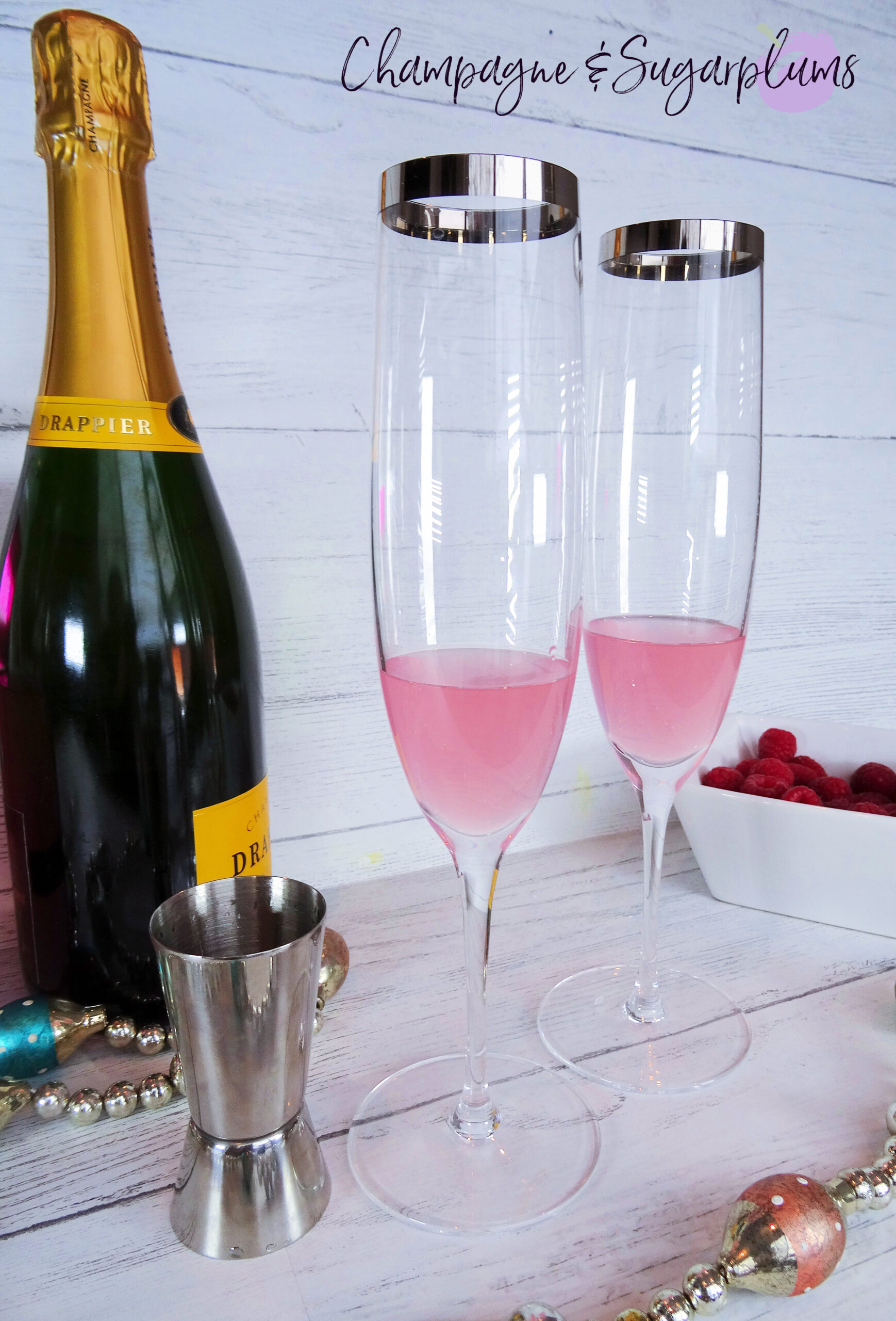 Champagne Cocktail with Pink Whitney Champagne and Sugarplums