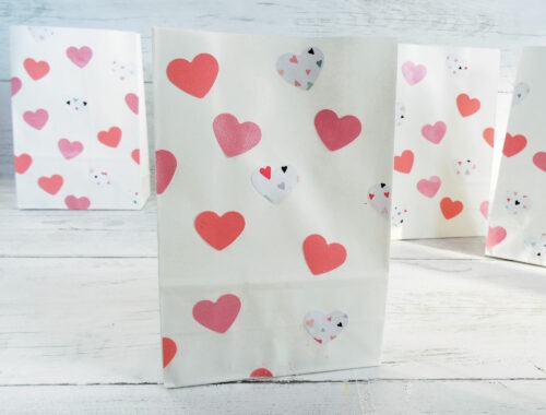 Valentine goodie bag with pink hearts on a white background by Champagne and Sugarplums