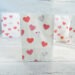 Valentine goodie bag with pink hearts on a white background by Champagne and Sugarplums