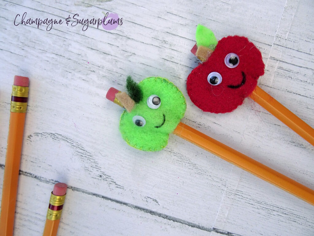 Felt Pencil Toppers - a green apple and a red apple on a white background by Champagne and Sugarplums