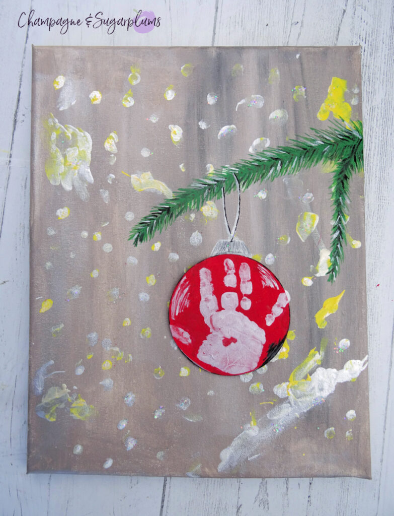 Close up of Handprint Christmas Art by Champagne and Sugarplums