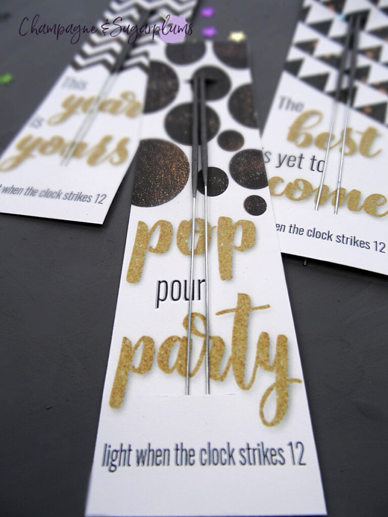 Three New Year's Eve Sparkler Cards on a gray background by Champagne and Sugarplums